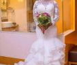 Bodycon Wedding Dress Elegant south African Nigerian Mermaid Wedding Dresses Plus Size 2018 Long Sleeve Sheer Neck Bodycon Fishtail Bridal Gowns Beaded Chic Layer Ruffles Cheap