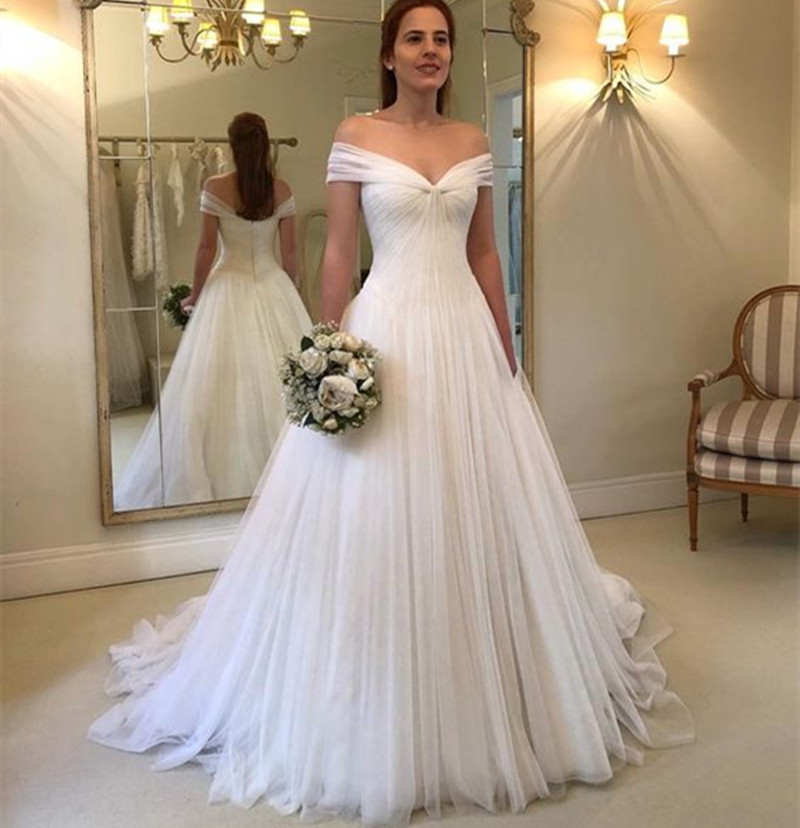 China Wedding Dresses Awesome Illusion Jewel Long Sleeves Wedding Dress with Beading Appliques Chapel Train Puffy Skirt Arabic Church Bridal Gowns Dresses 2019