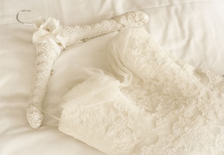germany lace wedding dress lying on bed 587e5f263df78c17b691e913