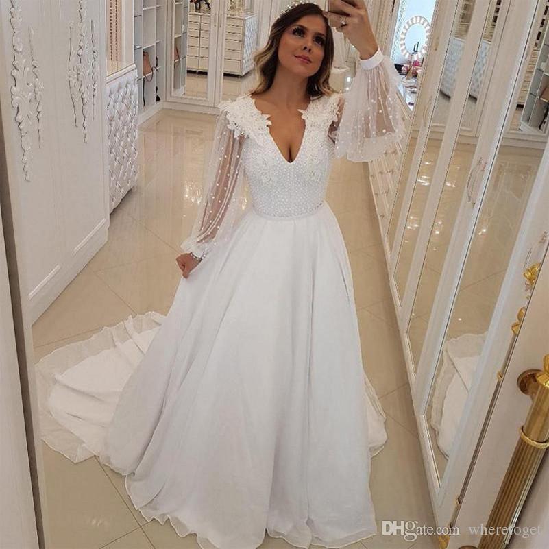 Pearl Wedding Dresses Luxury 2019 New Unique Design A Line Wedding Dresses Pearls Beaded V Neck Bridal Gowns with Long Sheer Sleeves Sweep Train Arabic Wedding Vestidos