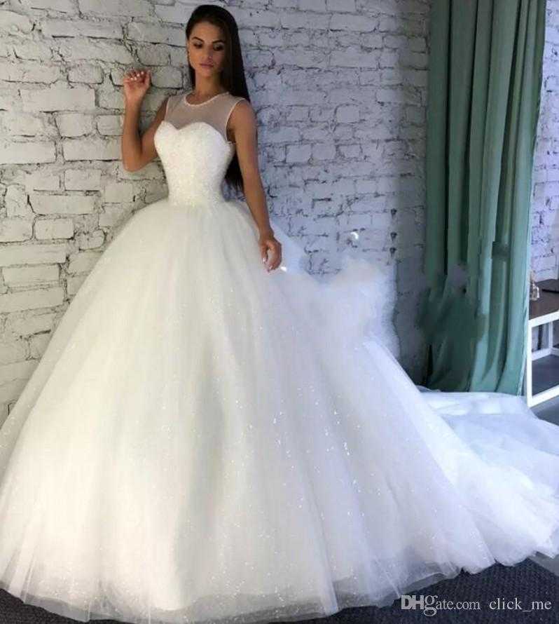 sparkling wedding dresses with sheer jewel neckline sequins a line wedding dress with count train custom made bridal gowns plus size ideas of wedding boutiques near me of wedding boutiques n