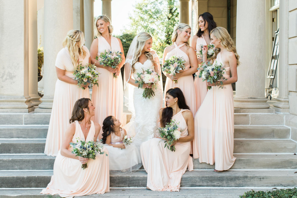 bridesmaids talking on the steps at Garden Court wedding venue in louisville ky